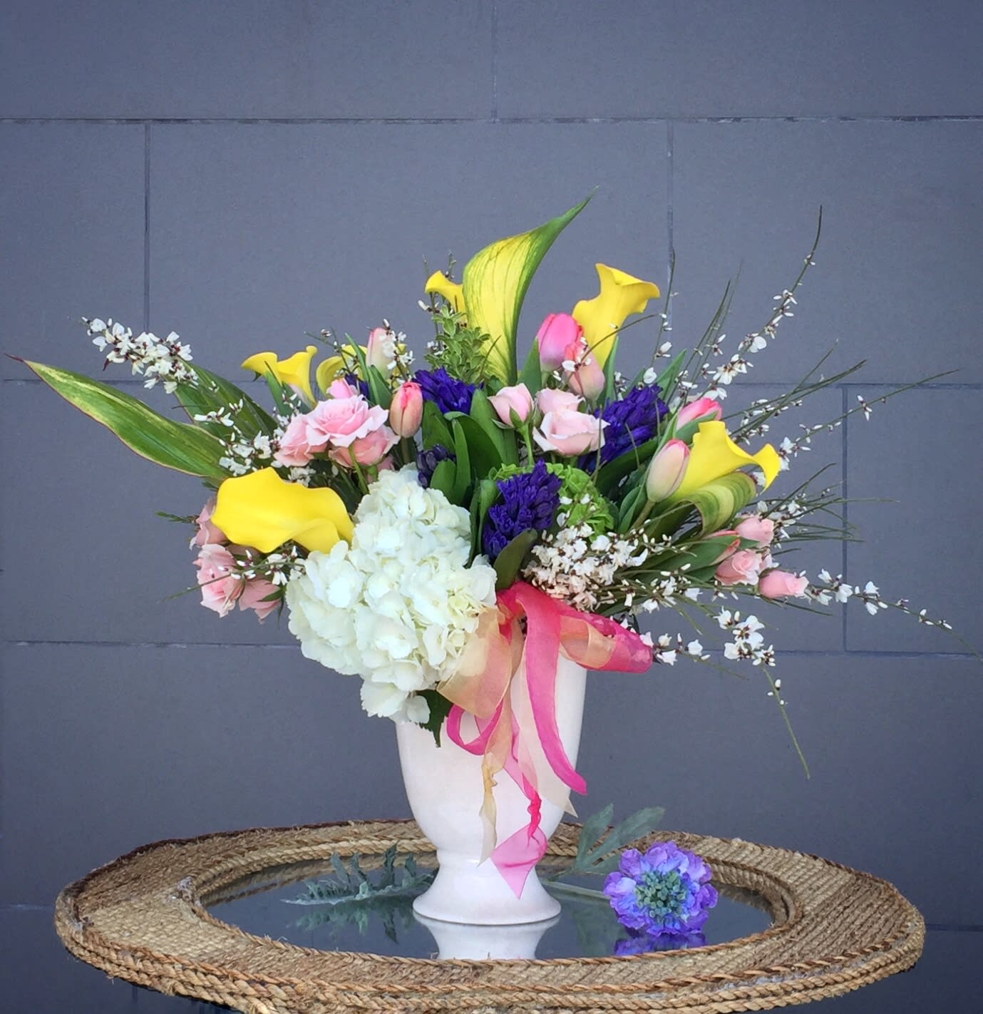 Touch of Spring - Lovely design including all premium flowers: calla lily, rose, tulip... and accents in a nice vase.