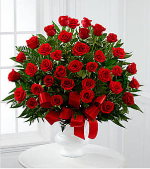  Soul of Splendor™ Arrangement - Soul's Splendor™ Arrangement is a rich display of the love shared throughout the life of the deceased. Brilliant red roses are elegantly displayed in a white designer plastic urn and accented with lush greens and red satin ribbon to create a beautiful tribute to honor your special relationship. GOOD arrangement includes 36 roses. BETTER arrangement includes 48 roses. BEST arrangement includes 60 roses. Your purchase includes a complimentary personalized gift message.