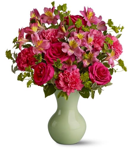 Posy Paradise Posy Paradise - A mix of fresh flowers in enchanting shades of hot pink - hand-delivered right to someone's door in a precious sweetheart vase - will make them marvelously happy. With fragrant blossoms such as roses and carnations in the mix it's guaranteed to get a smile! A mix of fresh pink flowers such as roses carnations and alstroemeria is delivered in a glass sweetheart vase. Approximately 15" (W) x 17.25" (H) Orientation: All-Around As Shown : TFWEB367 Available for local delivery only
