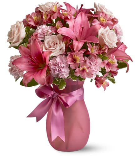 Always and Forever Always and Forever - What's pretty in pink this Valentine's Day? A versatile bouquet of mixed pink flowers is perfectly appealing and will give wonderful memories to a loved one always and forever. A thoughtful gift for a favorite friend mother grandmother or anyone special. A mix of fresh pink flowers such as roses Asiatic lilies carnations and alstroemeria is delivered in a frosted pink vase adorned with a pink satin ribbon. Approximately 13" (W) x 17" (H) Orientation: All-Around As Shown : TFWEB345 Available for local delivery only