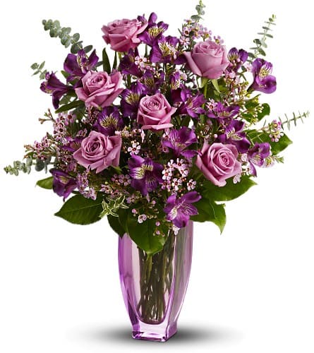 Teleflora's Dreaming of Roses Teleflora's Dreaming of Roses - This gorgeous bouquet aptly named for its light and delicately arranged blooms features the most luscious lavender roses imaginable. Artistically arranged in a pale lavender vase the mix of flowers is breathtaking. The magnificent arrangement includes dark purple alstroemeria lavender roses and lavender waxflower accented with assorted greenery - delivered in a stylish lavender vase. Bouquet is approximately 13" W X 18" H Orientation: All-Around As Shown : TFWEB575 Available for local delivery only