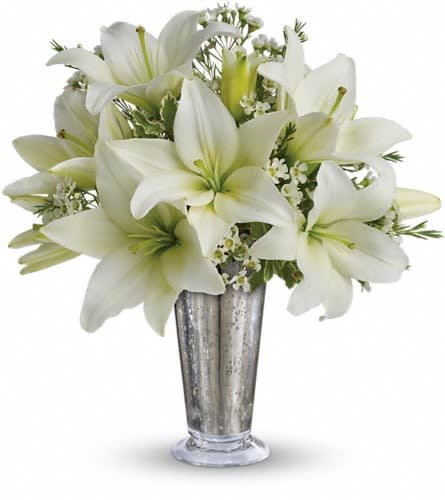 Written in the Stars by Teleflora Written in the Stars by Teleflora - This classic silver and white arrangement is a stunning way to let that special someone know how you feel. Inspired by a romantic night sky it's a dazzling way to pay homage to your years together. Elegant white lilies and pretty white waxflower stems are exquisitely arranged in a silver Mercury Glass Antique vase that's reminiscent of a star-filled sky. It really is a wish come true.Approximately 12 1/2" W x 14" H Orientation: All-Around As Shown : T7-1ADeluxe : T7-1BPremium : T7-1C