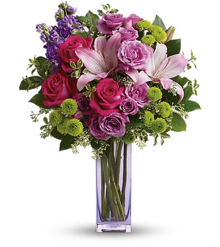 Teleflora's Fresh Flourish Bouquet Teleflora's Fresh Flourish Bouquet - Color them happy with this bold beautiful mix of hot pinks flirty lavenders and lime greens! Hand-delivered in a lavender glass vase this posh present pampers your loved one on a special day - or any day at all! This luxe bouquet includes hot pink roses lavender spray roses pink asiatic lilies lavender stock green button spray chrysanthemums pitta negra seeded eucalyptus and lemon leaf. Delivered in a lavender vase.Approximately 15 1/2" W x 19 3/4" H Orientation: One-Sided As Shown : TEV40-2ADeluxe : TEV40-2BPremium : TEV40-2C