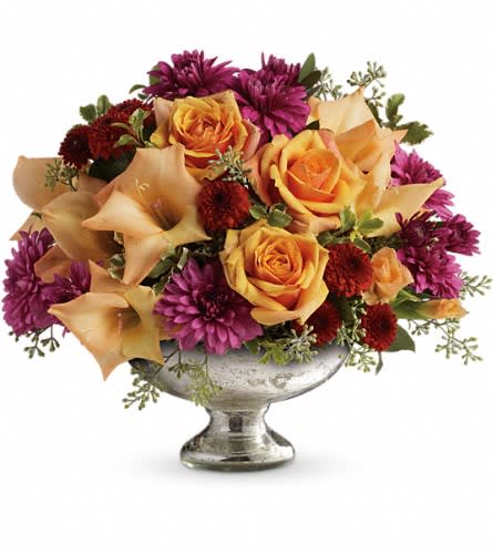 Teleflora's Elegant Traditions Centerpiece Teleflora's Elegant Traditions Centerpiece - Fall in love with this elegant arrangement. Orange roses and gladioli are arranged to perfection in our mercury glass bowl. This exquisite bouquet includes orange roses orange gladioli and lavender cushion spray chrysanthemums accented with assorted greens. Delivered in a Teleflora mercury glass bowl.Approximately 14" W x 11 1/2" H Orientation: All-Around As Shown : TFL04-3ADeluxe : TFL04-3BPremium : TFL04-3C