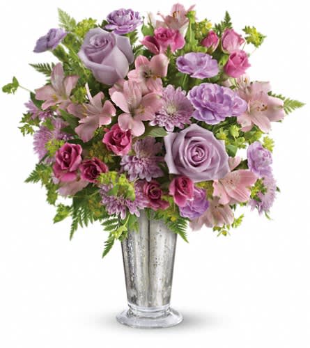 Teleflora's Sheer Delight Bouquet Teleflora's Sheer Delight Bouquet - The essence of femininity. Delight her with flirty-fun lavender and pink blooms presented in a gorgeous Mercury Glass julep vase. It's a gift that will sparkle in her memory forever. Includes lavender roses pink alstroemeria miniature lavender carnations and lavender chrysanthemums accented with fresh bupleurum and leatherleaf fern. Delivered in a Mercury Glass large julep vase.Approximately 14" W x 15" H Orientation: One-Sided As Shown : TEV29-1ADeluxe : TEV29-1BPremium : TEV29-1C