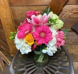 Sweet Valley - This lush arrangement includes Gerbera Daisies, lilies, roses and other in season flowers. 