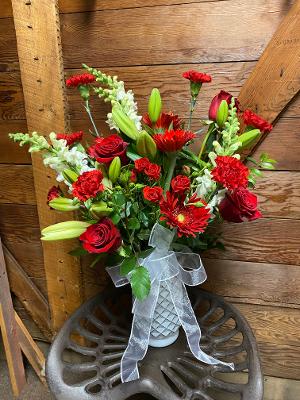 Ruby Red  - Ruby Red is a Radiant mix of Red and White flowers. This stunning collection includes, roses, gerbera daisies, carnations, snapdragons, lilies, and other seasonal flowers. 