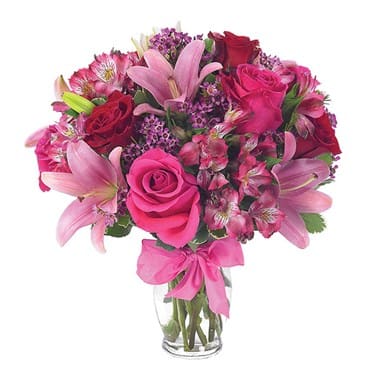 EUROPEAN ROMANCE BOUQUET EUROPEAN ROMANCE BOUQUET - This flirtatious combination of Asiatic lilies, waxflower, alstroemeria and roses makes a thoughtful gift they'll not soon forget. A pretty pink ribbon and clear fluted glass vase