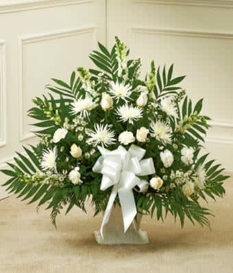 White Sympathy Floor Basket - A beautiful sympathy floor basket hand arranged with stunning white flowers. Created with fresh seasonal floral stems, including white roses, spider mums and snapdragons. Hand arranged by a local florist and delivered with care. Medium measures approximately 32&quot;H x 38&quot;L.