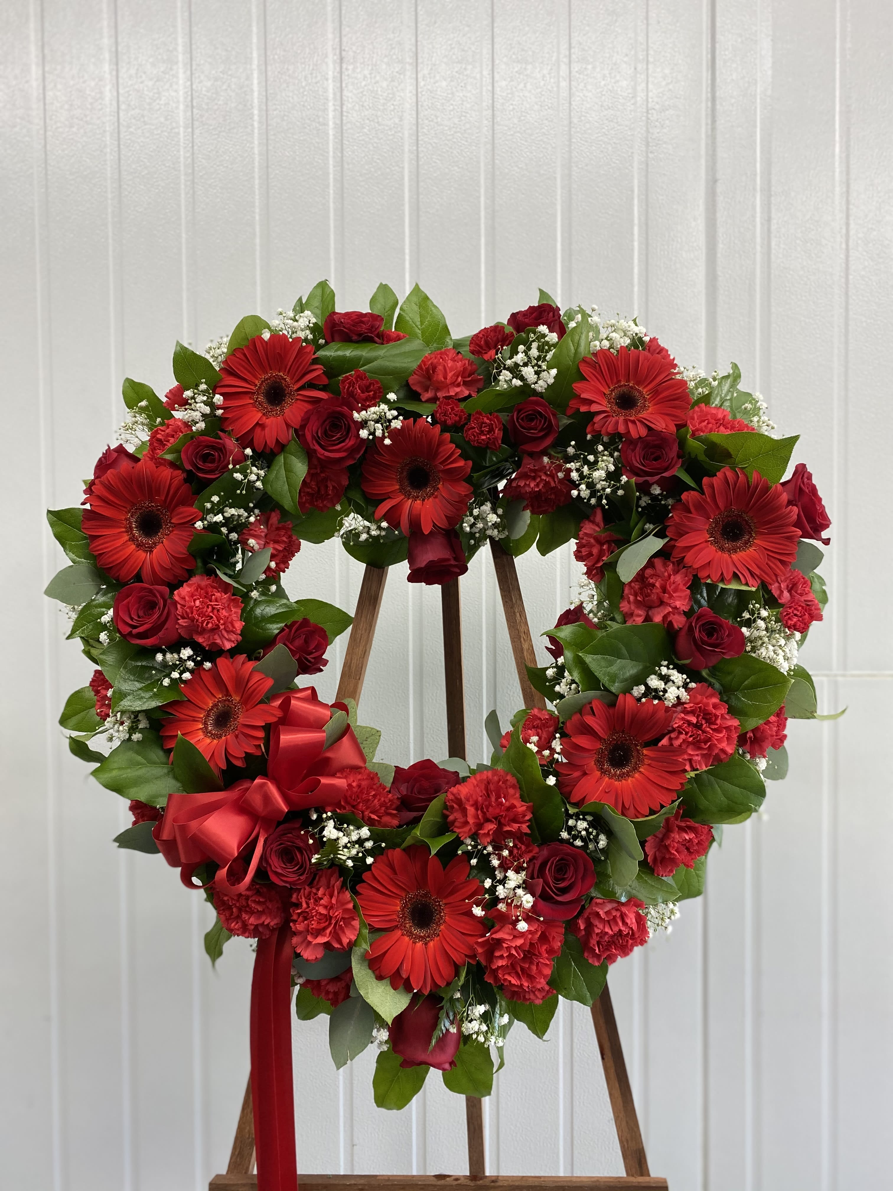 Open Heart Standing - Our open heart -shaped red floral arrangement shows sentiment for the love of someone who has passed away. 