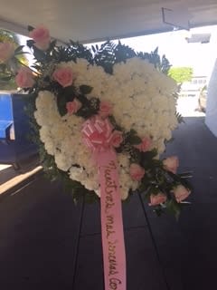 TOUCH MY HEART - WHITE SOLID HEART WITH CARNATIONS AND PINK ROSES.... WE CAN CHANGE THE WITH THE COLORS OF YOUR PREFERENCE, JUST PUT IN THE SPECIAL INSTRUCTIONS.  Flowers and similar colors