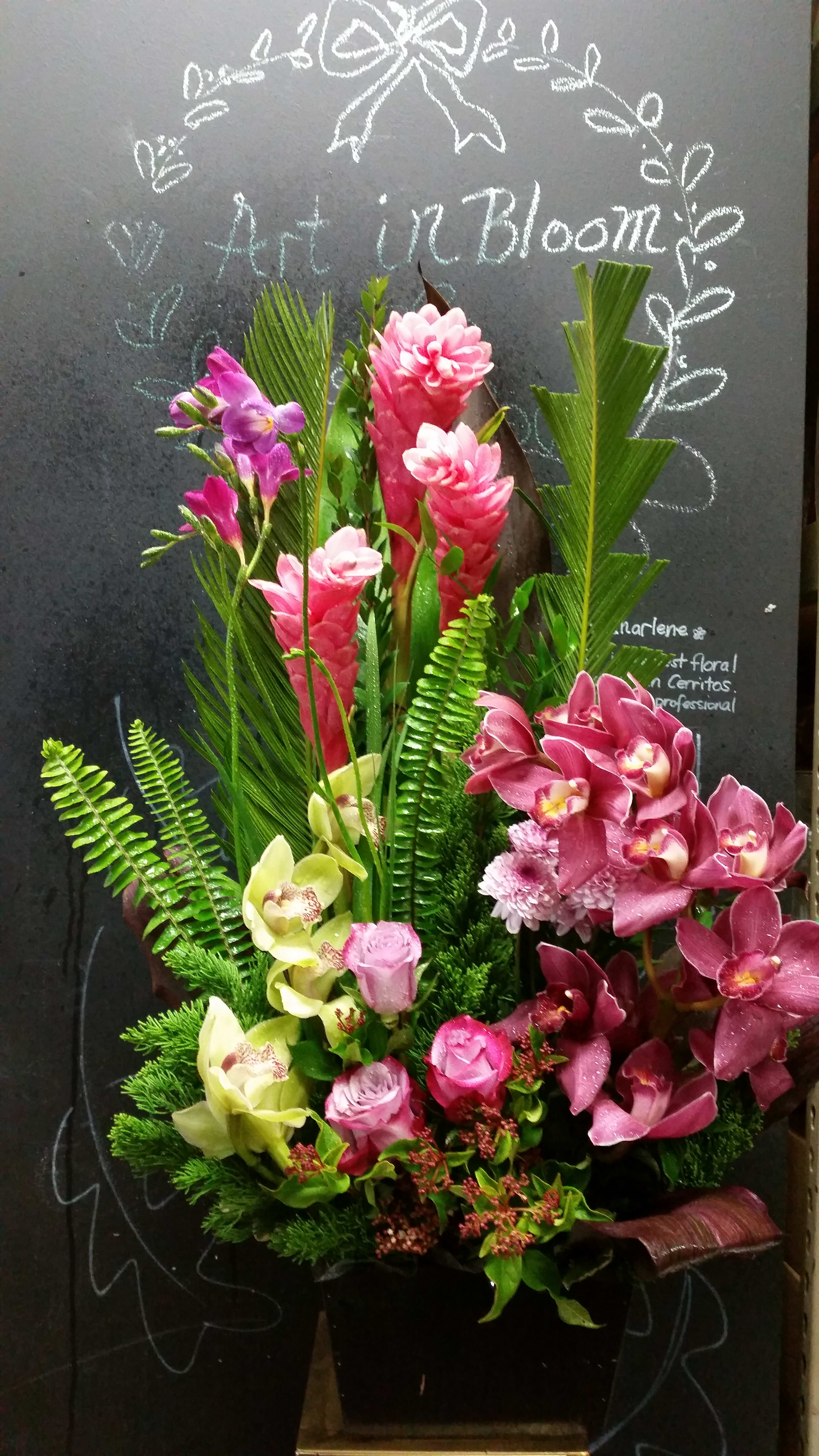 Tropical lovers - Tropical flower arrangement in the container Ginger and cymbidium orchids