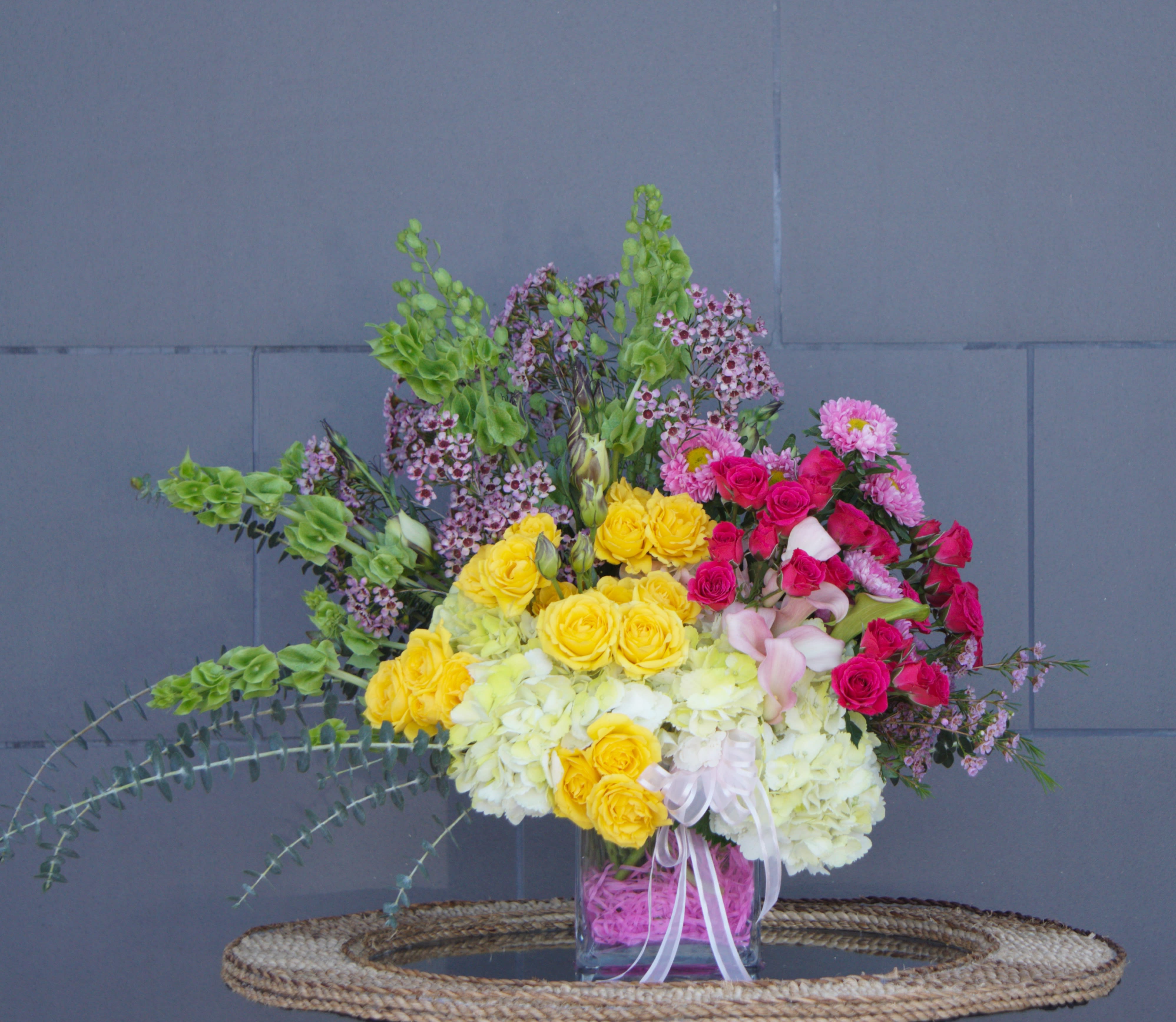 Spring Ombre - Sweet design including all premium fresh flowers: rose, orchid, larkspur, hydrangea...and accents in a nice vase.