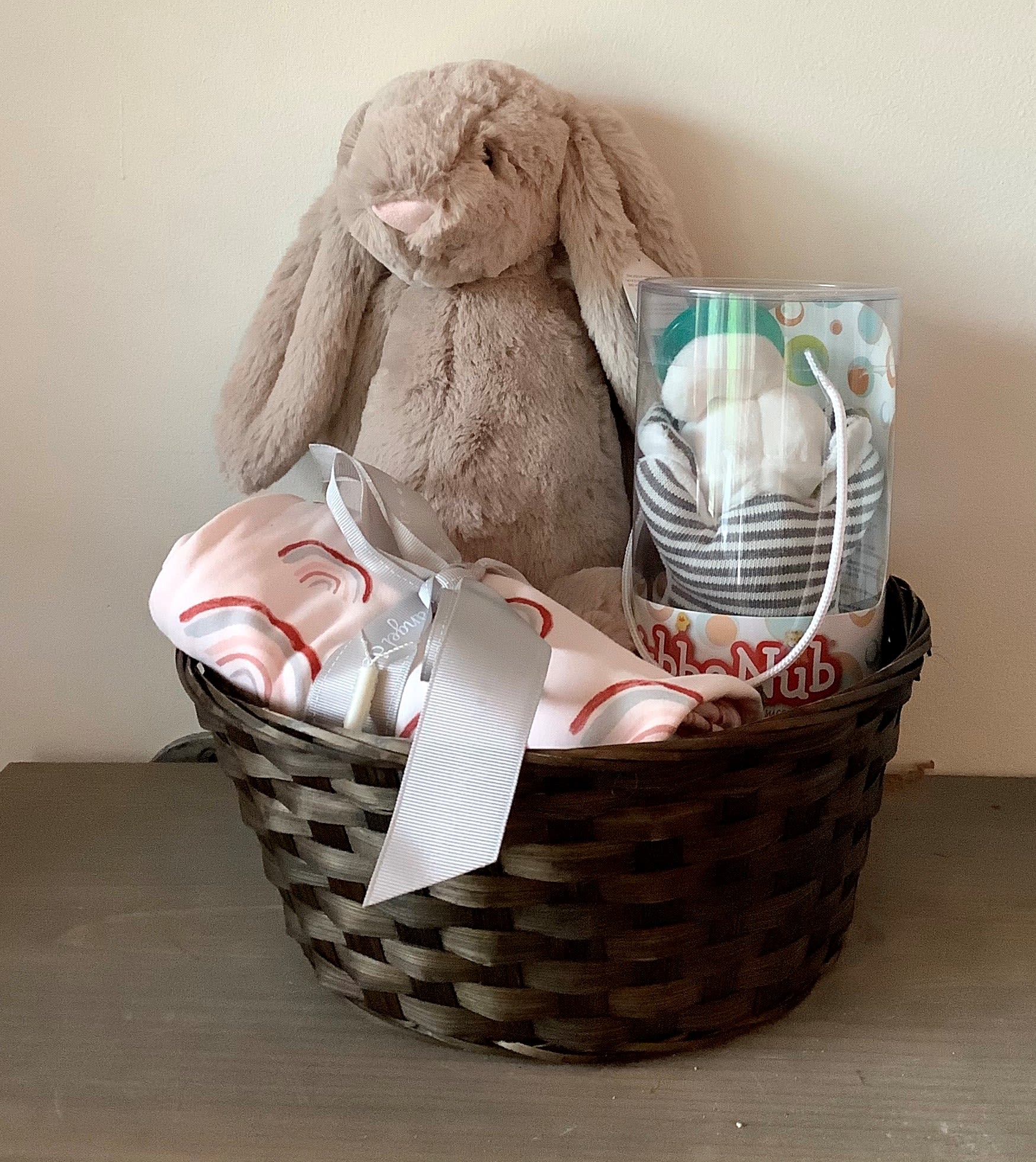 Baby Girl Gift Basket  - Send this sweet little bundle of gifts to the new baby in your life. A jellycat stuffed animal,a wubb a nubb lovie, and a receiving blanket are included. As the price increases, we will upgrade the jellycat and add more newborn goodies.