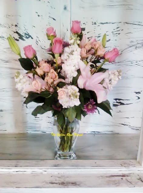 Pink Passion - This beautiful arrangement will fill the room with a scent she will never forget.  consist of roses, stock, lilies and other beautiful blooms. 