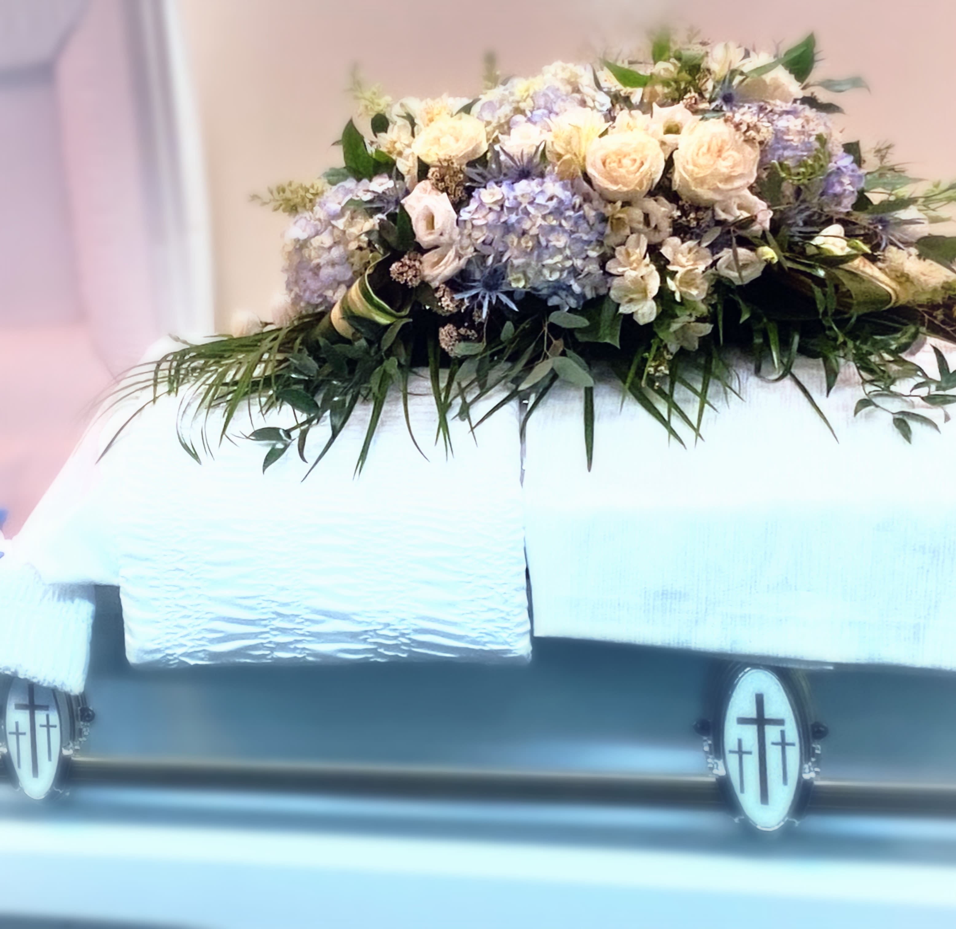 The Casket Spray - The Casket Spray is a lush,elegant, and stylized casket arrangement. Customer can request any color palette by adding notes to their order. Example” iv want this in all white, or yellow and pink ect.... we also encourage you to call to discuss your inspirations. 