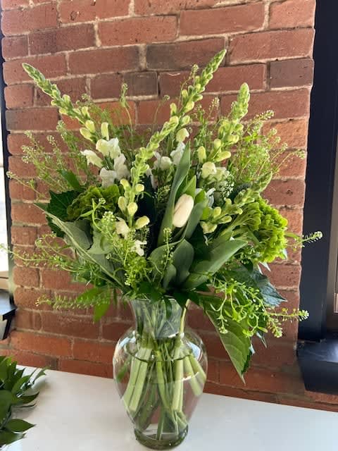 Fields of Ireland Fields of Ireland - Classic green and white arrangement will have you dreaming of the Irish Countryside. Full of white tulips, green hydrangea,snapdragons, bells of Ireland,