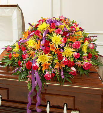 Cherished Memories Half Casket Cover - Bright - Product ID: 91385   Send an elegant expression of your love and a touching tribute to a loved one with this bright casket cover arrangement. Features gorgeous bright blooms such as long-stem roses, lilies, spider mums, larkspur, carnations, monte casino and more Traditionally sent by the immediate family to the funeral home Our florists use only the freshest flowers available, so colors and varieties may vary Measures approximately 18âH x 38&quot;L x 28&quot;D