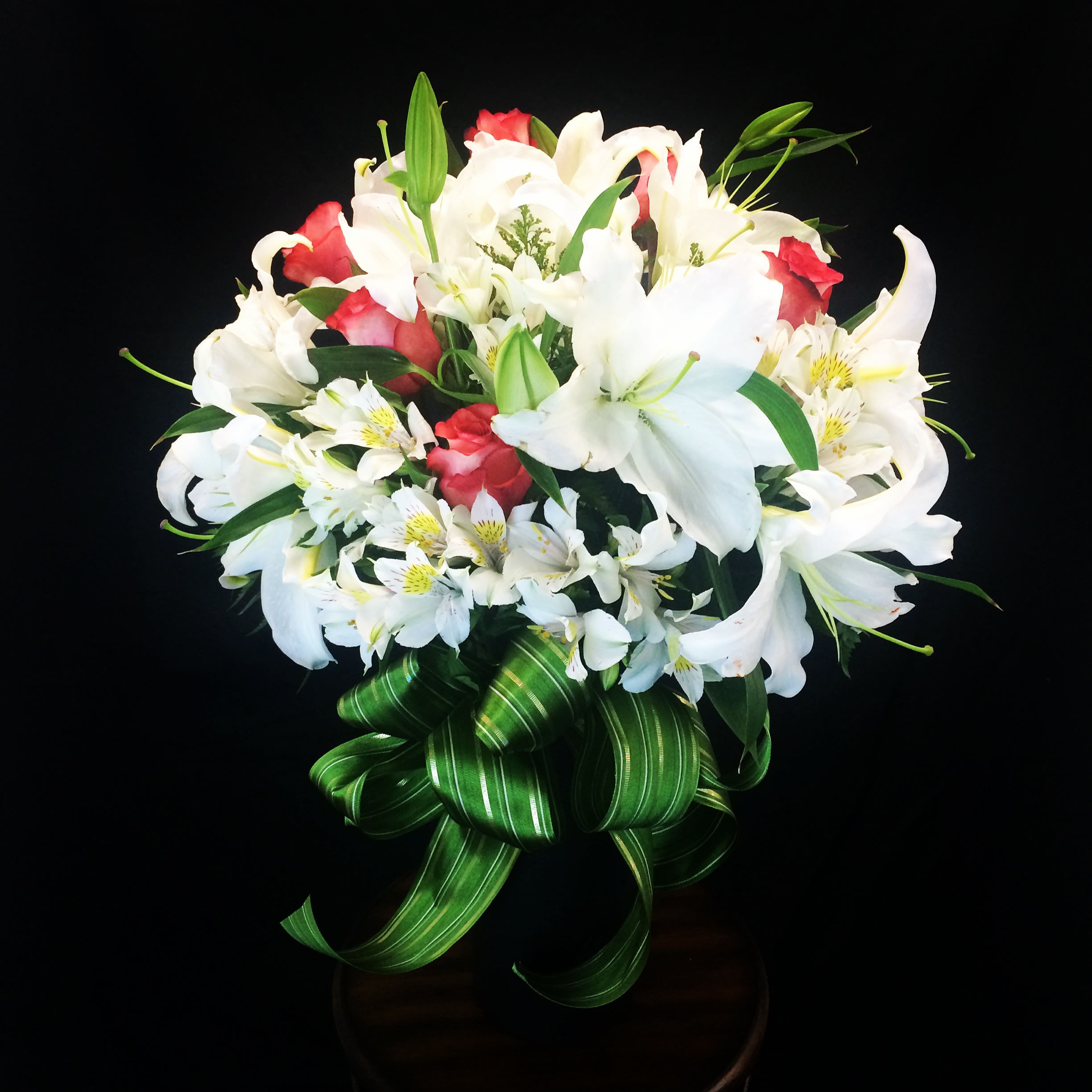 Love and Warmth ! - This is an Elegant Contemporary Floral Arrangement with White Lily, Coral Roses and White Alstromeria. Perfect arrangement for Sympathy Tribute. Beautiful and elegant big Asiatic white lilies with coral color makes this arrangement one of our best design for Sympathy Flowers or may be just because you love some one so much. Comes with 8 Lily Bloom, 6  Roses and White Alstromeria.  For 9 Roses upgrade to deluxe. For 10 Lilies, 9 Roses upgrade to Premium. Call for special Request. Arrangements comes with Tall Contemporary Glass vase. We add a fabulous bow, to makes this flower bouquet more stunning. Our Floral designer might change the design or color depend on the availability of certain colors. But we promise to make the design beautiful on every arrangements with similar value flowers.  Garden of Roses is the Best Local florist in Moreno Valley and Surrounding areas. We won the Best Flower Shop Award in 2013 out of 30 florists in Inland Empire, CA. This Flower Arrangement will bring Smile to your loved ones, and we promise to provide the best Flower Delivery Service you ever have. We are not an Online Flower Delivery Services, We are real local florist! We will create a stunning bouquet and hand deliver the Arrangement on your special occasion to your special person. Send this Elegant Flower Bouquet for Sympathy Wishes, Get Well Wishes, Just Because Flowers, Thinking of You Flowers, Miss you flowers, Valentineâs Day Flowers, Mothers Day Flowers.