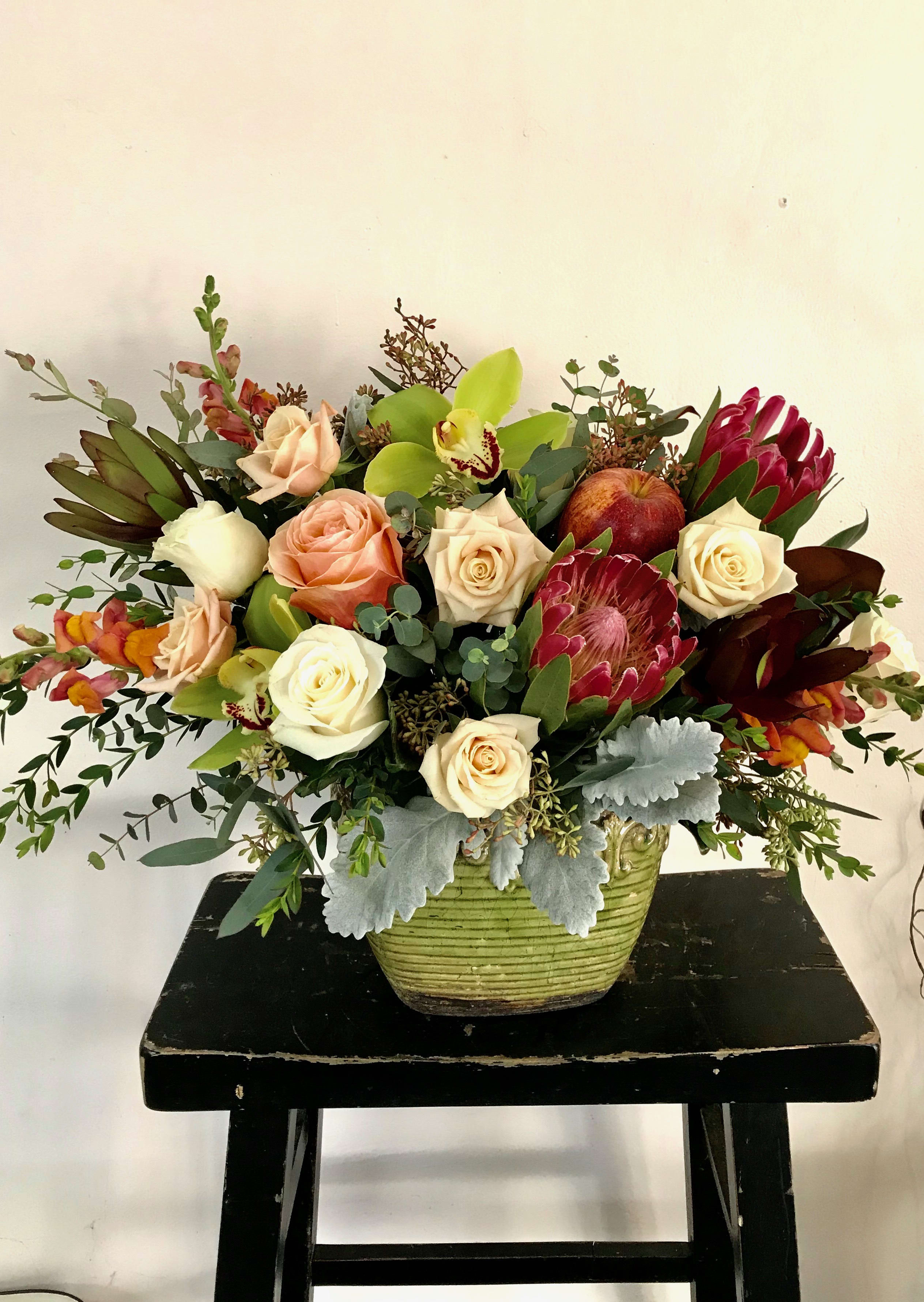 Rustic Elegance - Cymbidium orchids, Pink Mink Protea, Kahala roses all in lovely neutral tones that the most feminine or masculine recipient will appreciate.
