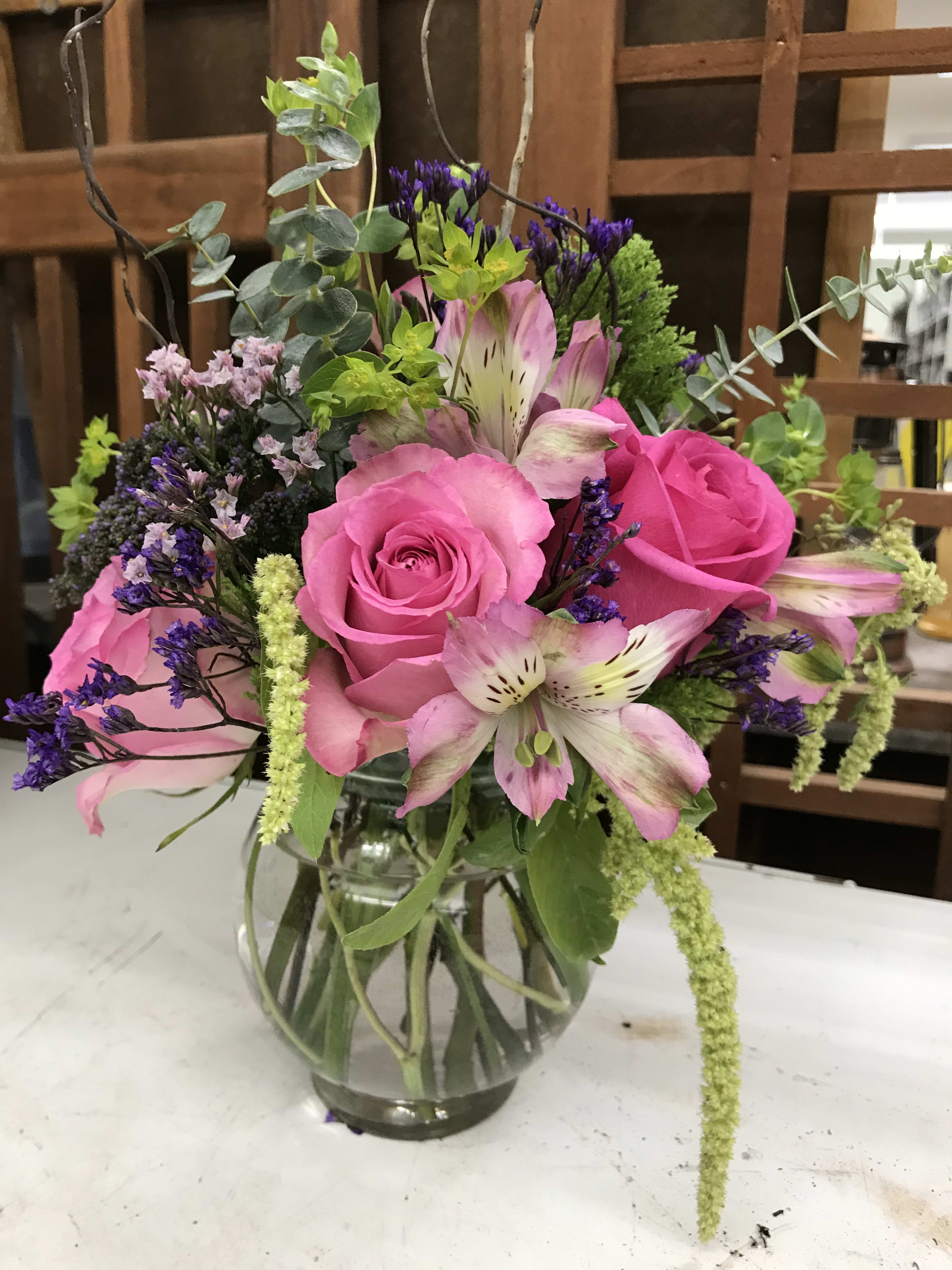 Pink it is - This pink themed arrangement is perfect for a desk, side table or hospital pedestal.It will include interesting greens and flowers according to season but will maintain the color scheme.
