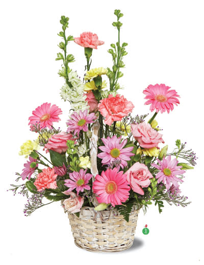 Summer Style - Like the breezy days of summer, this mix of pink, yellow and white daisies, carnations, roses and stock – presented in a whitewashed carrying basket – is sure to charm and delight! Perfect for any picnic table, or to brighten someone’s day.