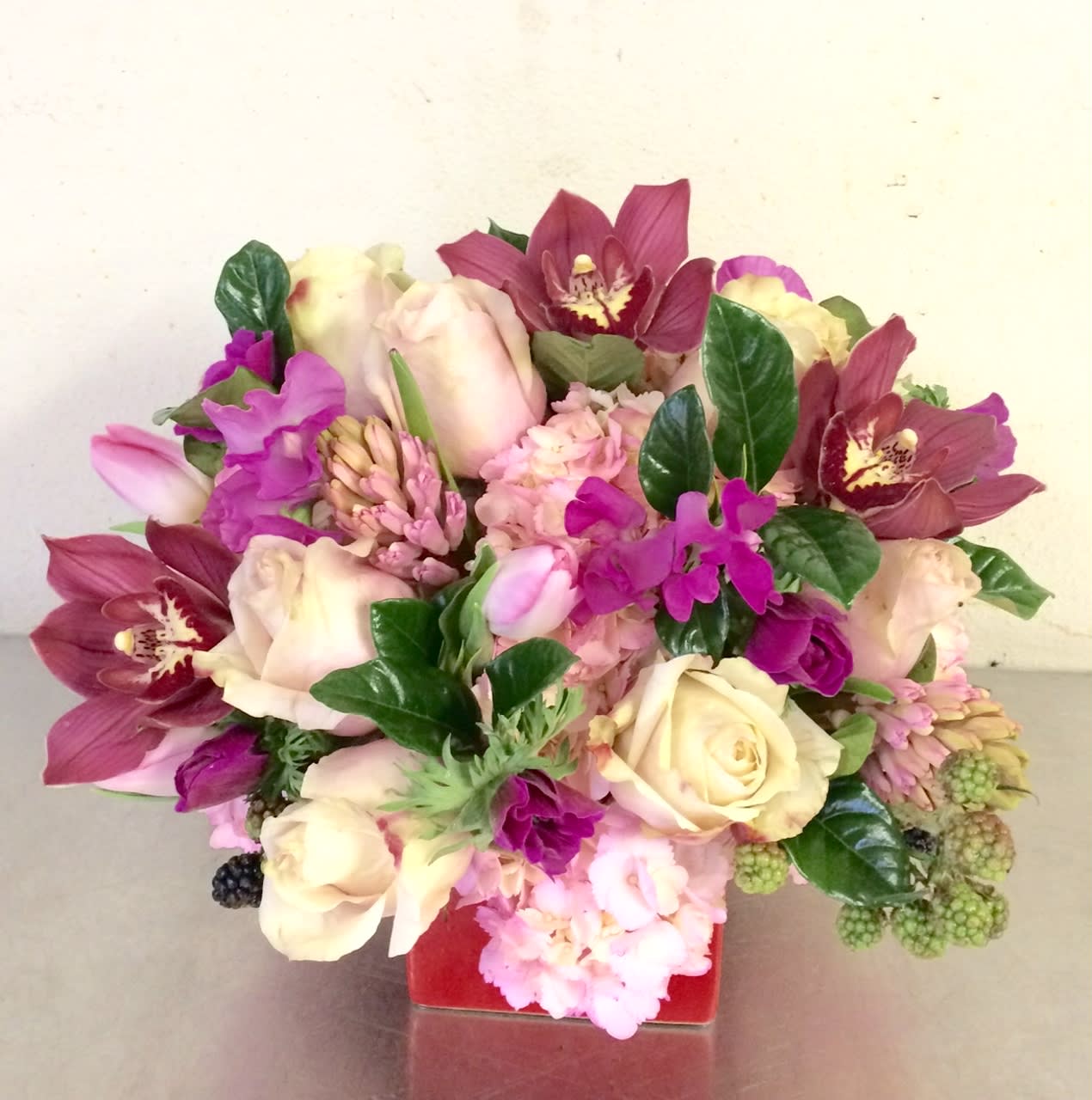 Spring Morning - a romantic bouquet of blush spring flowers set in a short vase 
