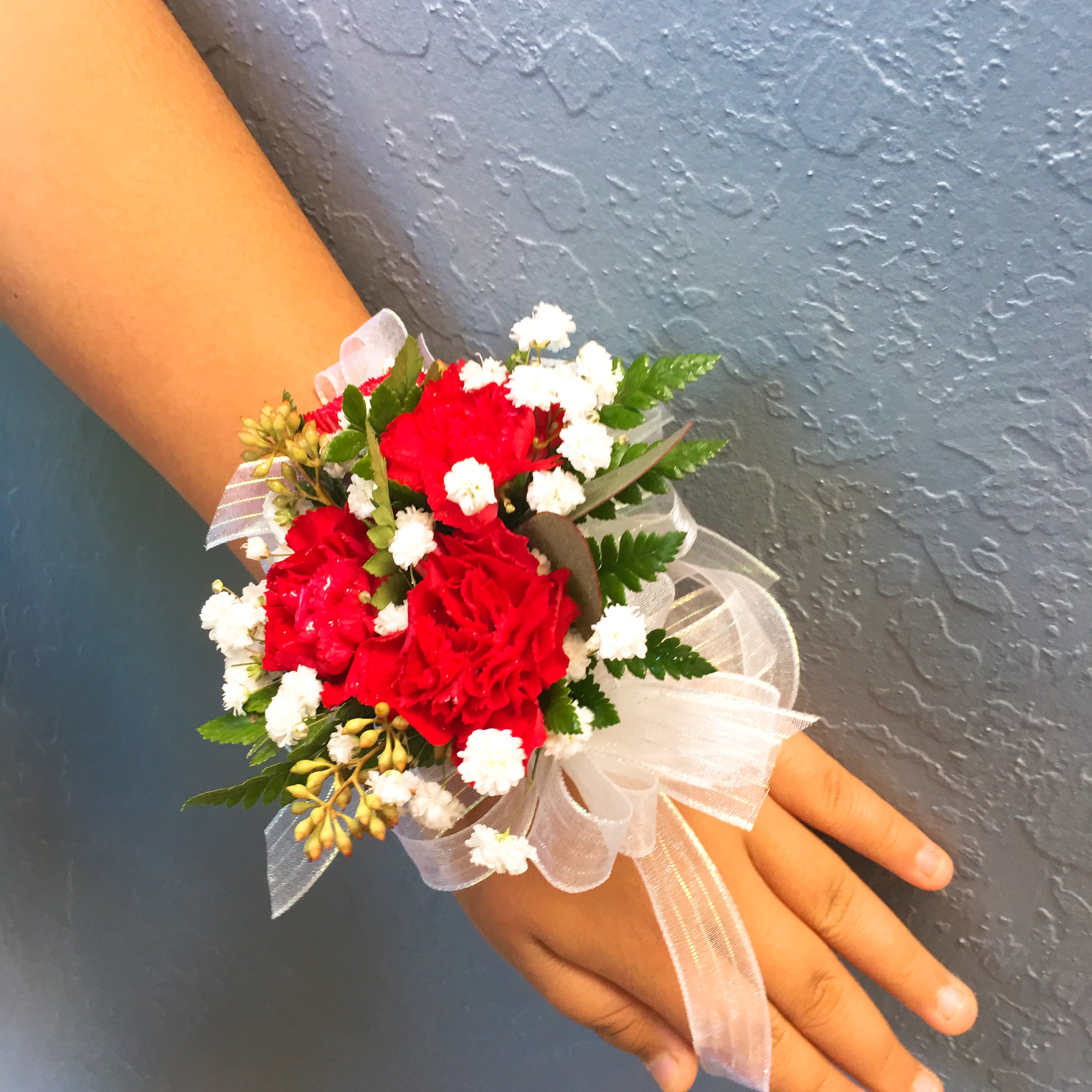 Red Mini Carnations Wristlet Corsage in San Jose, CA | La Floriya