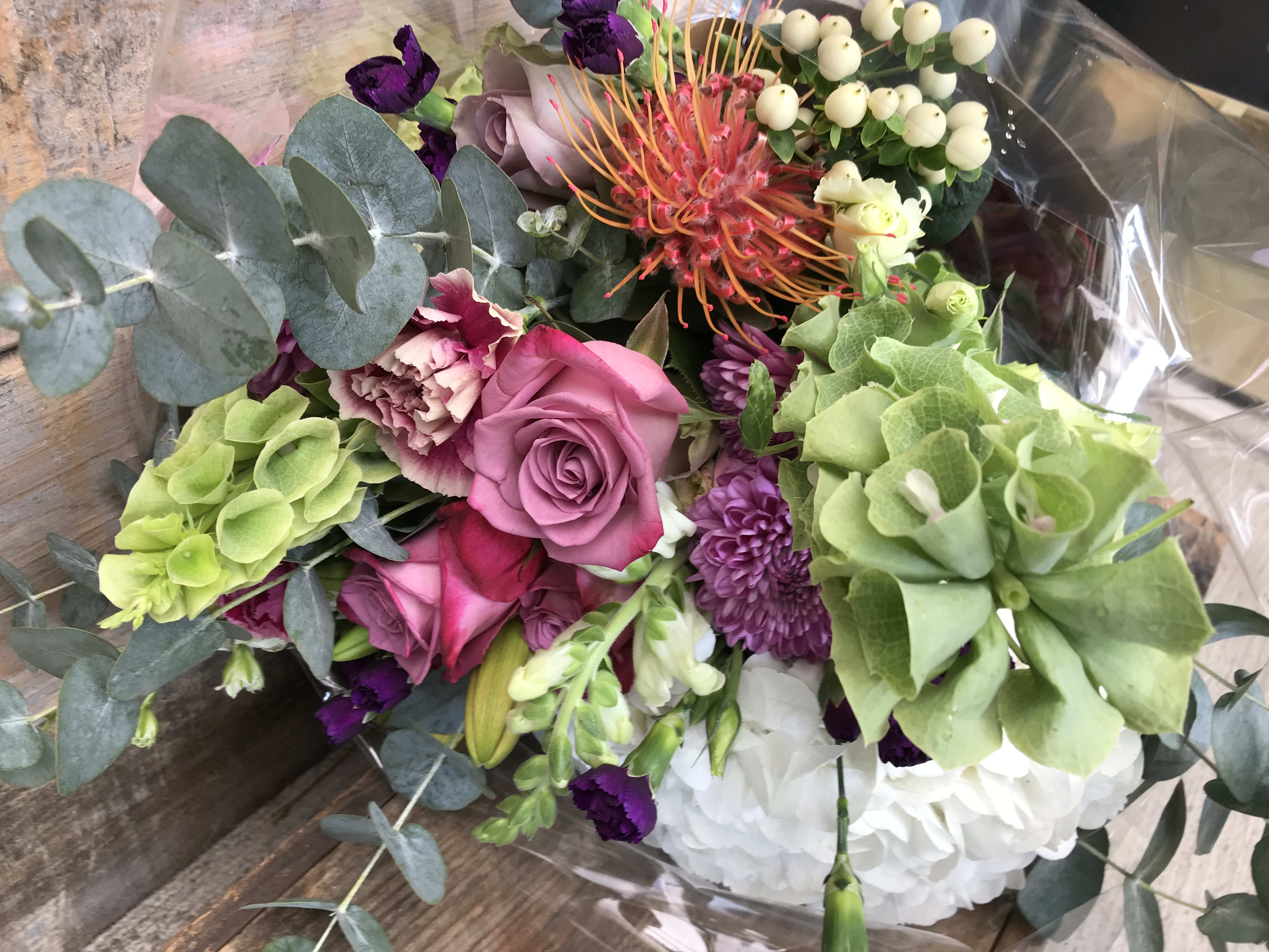 Designer wrapped bouquet. - Designers wrapped bouquet, tied with a beautiful ribbon. ready to put straight into a vase in your home or office. These will be seasonal blooms.