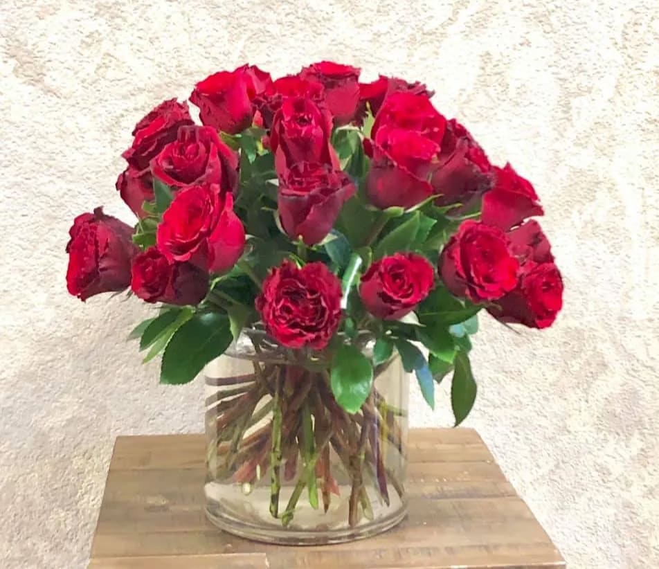 18 red roses in a cylinder vase in Santa Clarita, CA Flower Finesse