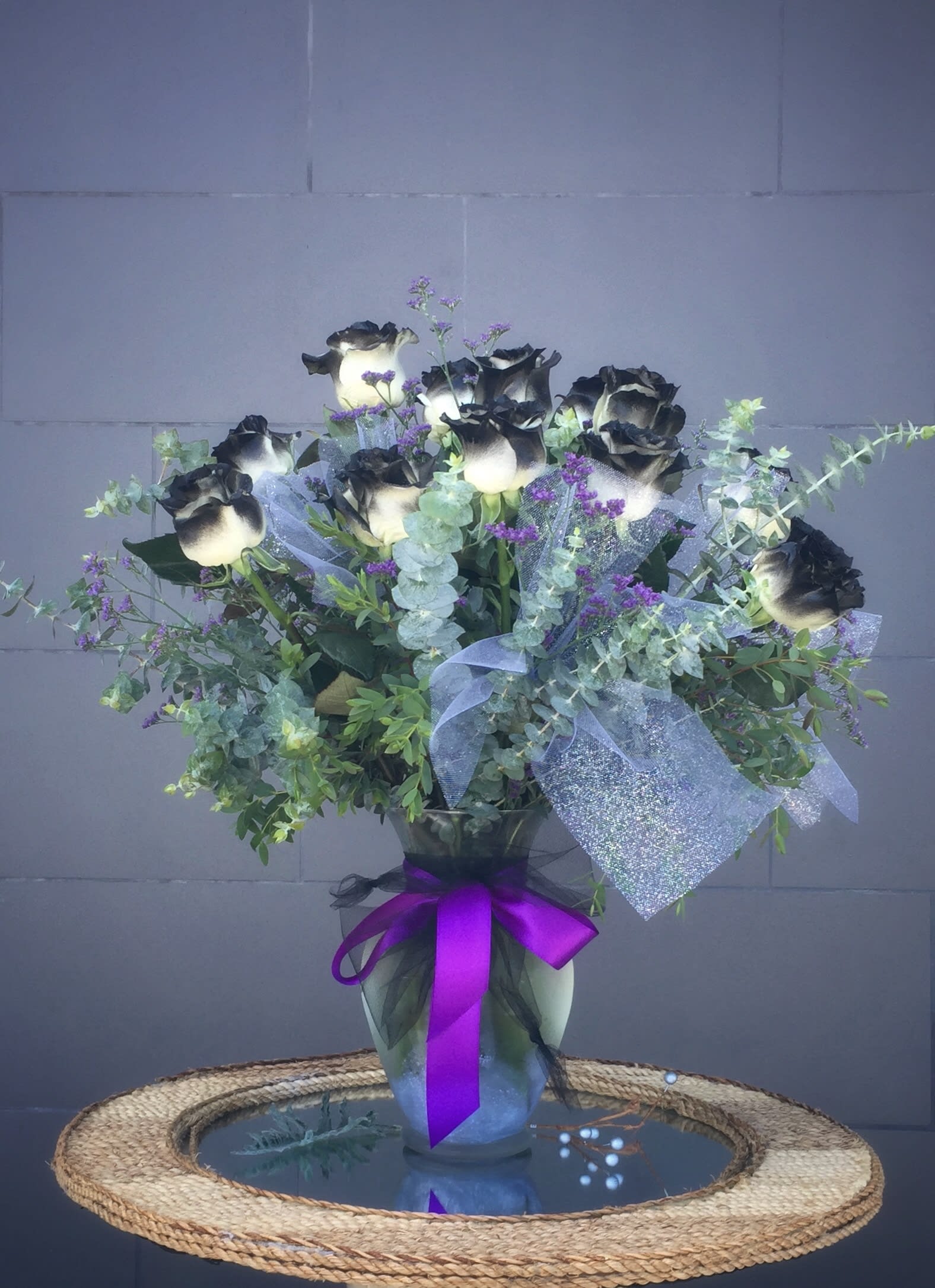 Black Magic - Black roses and accents in a tall glass vase STANDARD: 12 ROSES DELUXE: 24 ROSES PREMIUM: 36 ROSES  