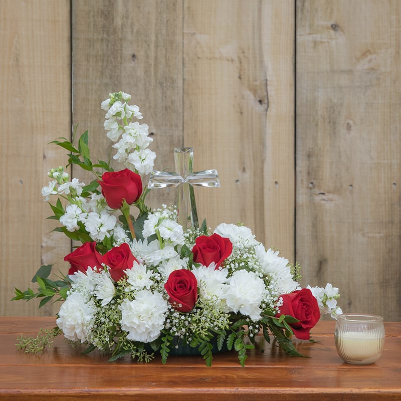 Faithful Blessings - This Faithful Blessings arrangement pays tribute to a life well-lived with every beautiful bloom. Red roses and carnations pop amongst this incredible arrangement of white hydrangea to create an impressive display of caring kindness.