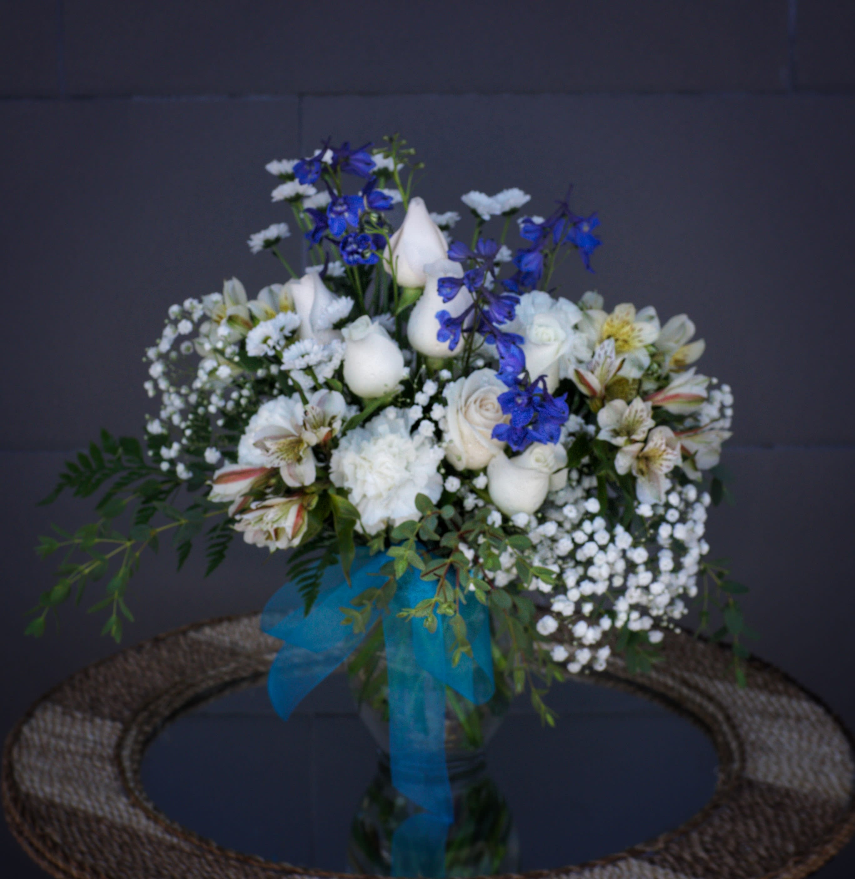 Seashore - Oceanic design including blue and white fresh flowers and accents. STANDARD: FIRST PHOTO DELUXE: SECOND PHOTO 