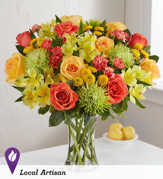 Citrus Sunshine™ Bouquet - LOCAL ARTISAN EXCLUSIVE Summertime calls for plenty of sunshine…and brighter-than-ever blooms. We’ve gathered a citrus-colored mix, creating a sensational bouquet to cheer up somebody’s day. Designed by Matthew Wohlfahrt from Floral Concepts in Houston, Texas, it’s a gift that delivers an abundance of beauty for every kind of celebration.  All-around arrangement with yellow and orange roses, yellow Peruvian lilies (alstroemeria) and button poms, orange mini carnations, green spider mums; accented with assorted greenery Artistically designed in a clear glass vase; measures 8&quot;H Large arrangement measures approximately 19&quot;H x 32&quot;W Medium arrangement measures approximately 18.5&quot;H x 31.5&quot;W Small arrangement measures approximately 18&quot;H x 31&quot;W Our florists select the freshest flowers available, so colors, varieties and container may vary due to local availability To ensure lasting beauty, Peruvian lilies may arrive in bud form and will fully bloom over the next few days