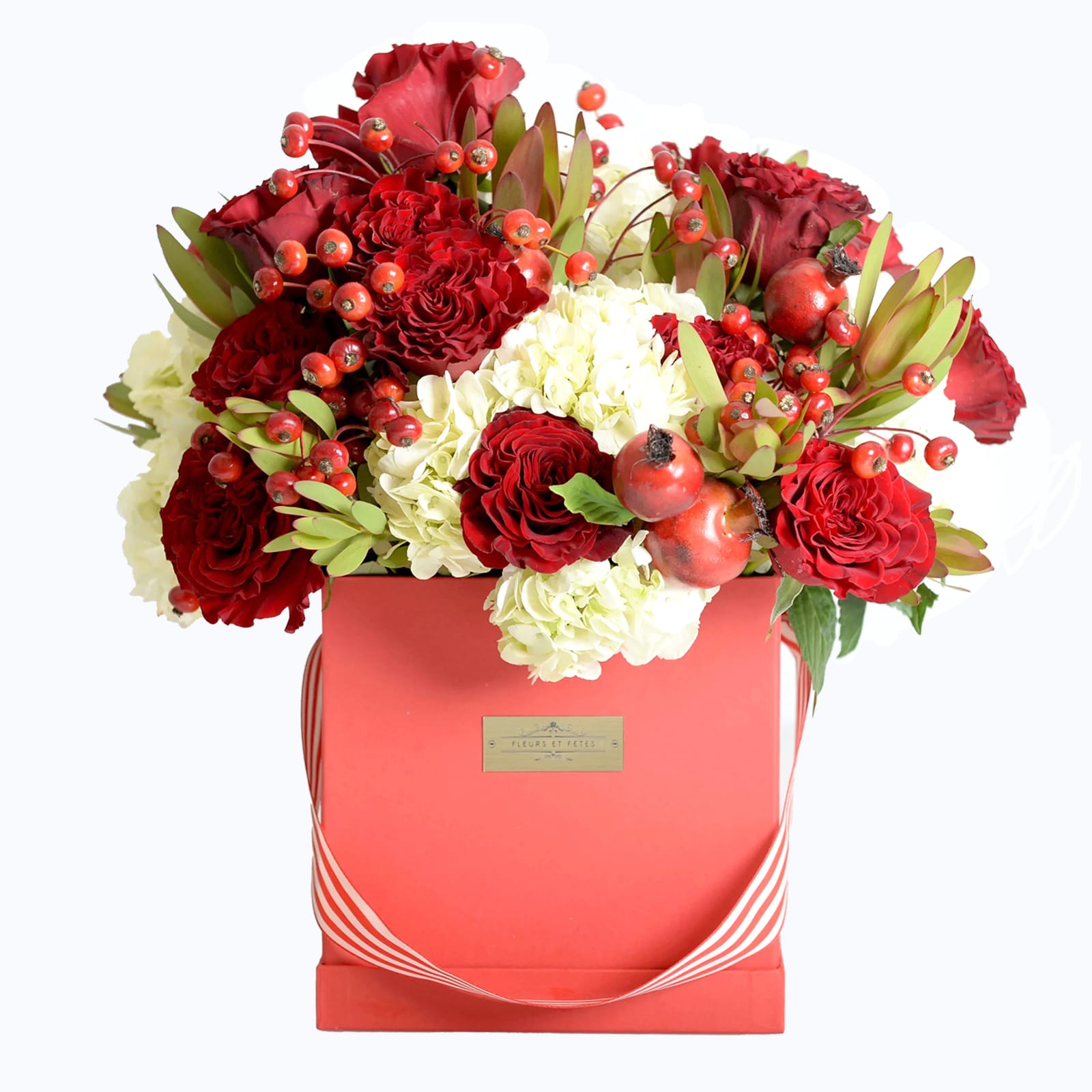 Attention - Featuring fresh flowers. Combining the innocence of white and the passion of red with a flair of femininity.  Designed in our large signature box.  *Due to Covid-19, some flowers may not be available. Fleurs et Fetes reserves the right to adjust the flowers and color depending on availability*