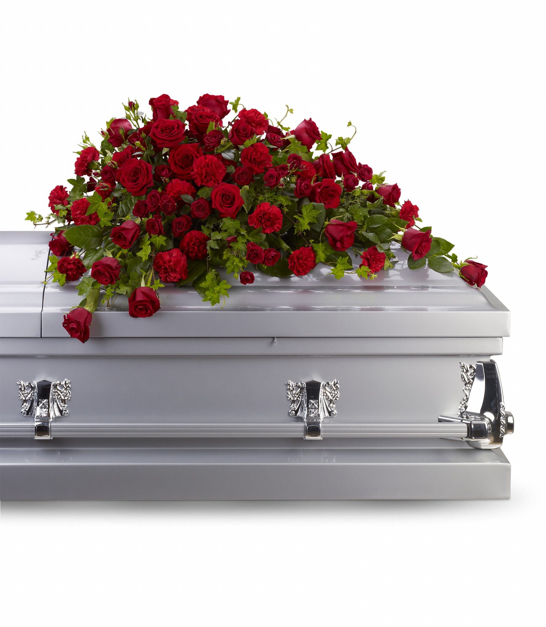 Red Rose Reverence Casket Spray - Red roses tell a story of love, beauty, and strength. This all-red spray graces the casket with accents of trailing ivy.  