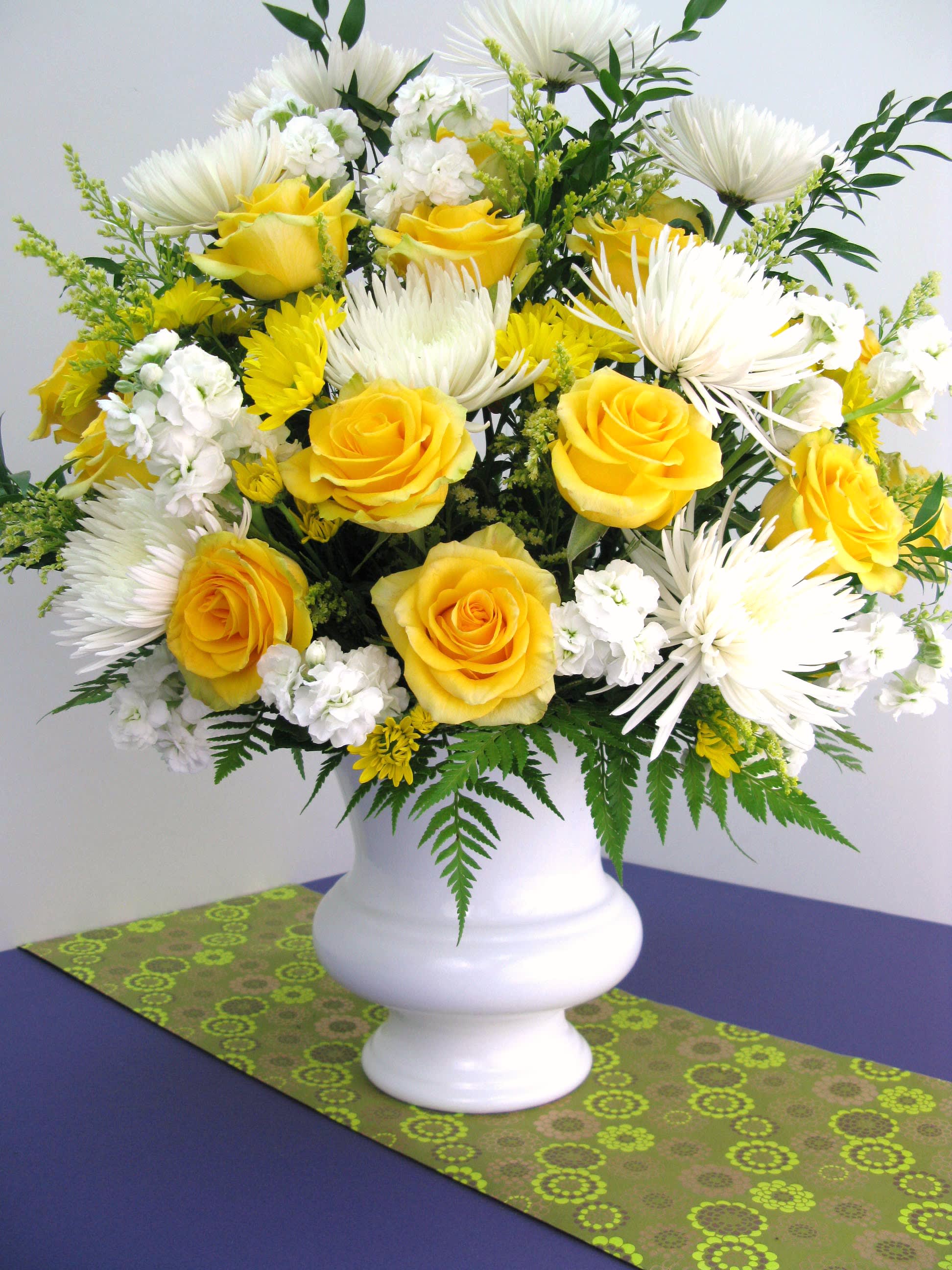 I'll Never Forget You I'll Never Forget You - White spider, yellow roses in a white vase.