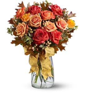 Graceful Autumn Roses Graceful Autumn Roses - A graceful mix of a dozen fresh, fragrant roses, in autumnal tones of orange and bi-color yellow, is as pretty as a picture when hand-delivered in a clear glass vase that's decorated with a golden satin ribbon. The perfect presentation for birthdays, anniversaries or any special occasion.