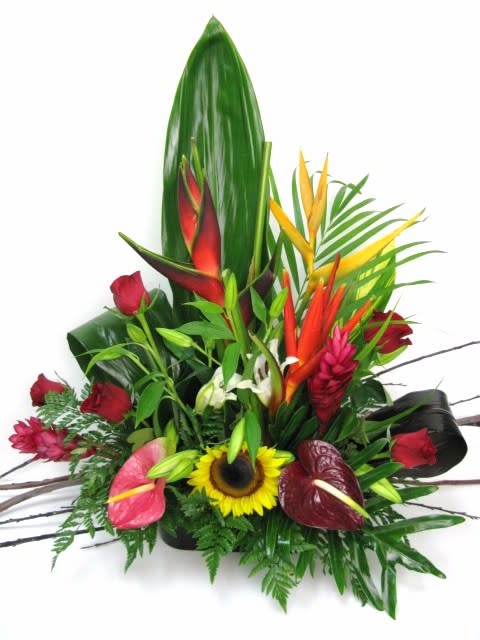 Tropical Garden Tropical Garden - Tropical arrangement where the mixed with roses lilies and tropical flowers to create a sunset look.