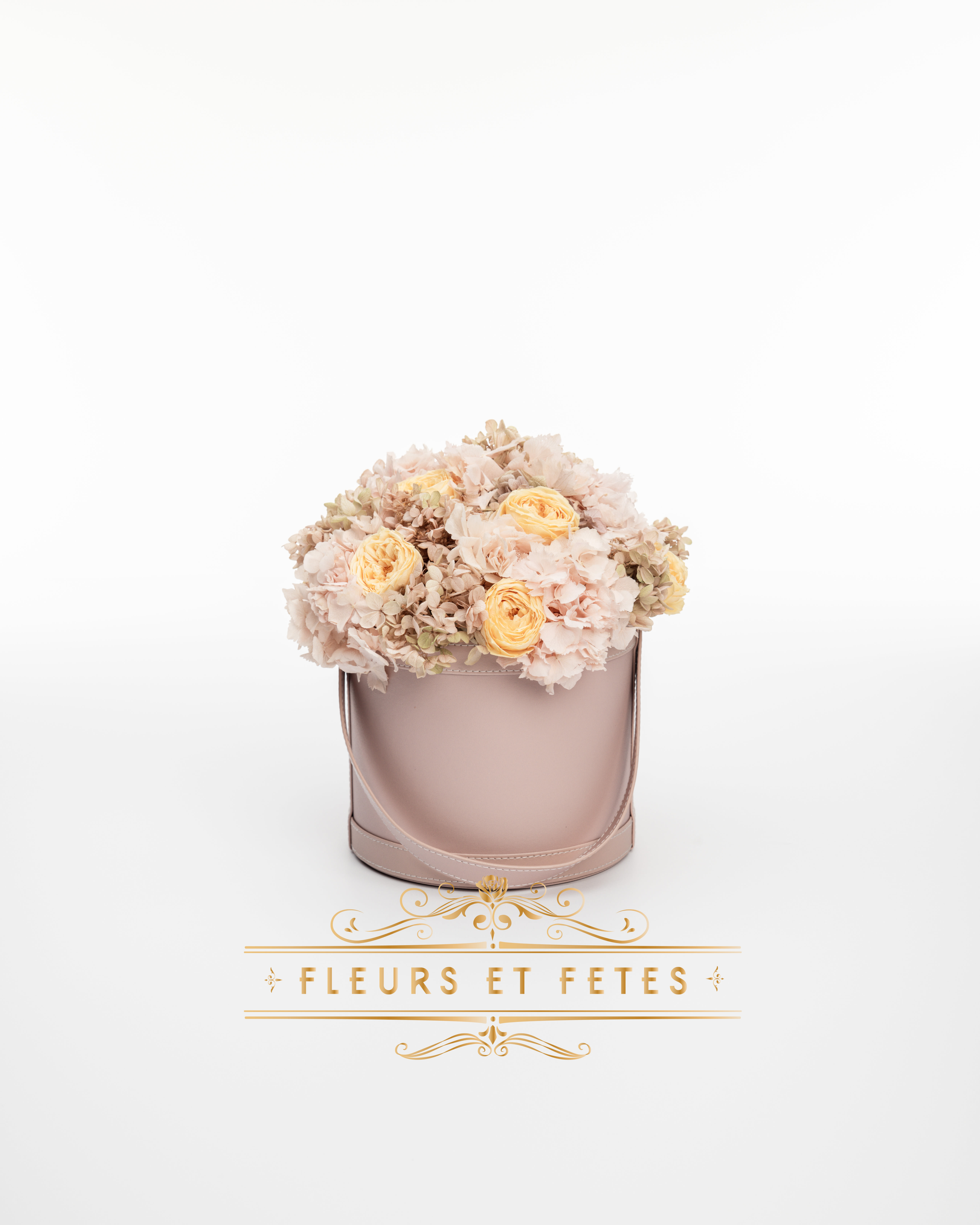 Medium vegan leather box with mix flowers option 4 - This timeless arrangement is a part of our Everlasting Collection and features real roses and hydrangea that last up to three years. Set in our hand-stitched vegan leather round box.   Our freshly picked Everlasting flowers have been chosen by expert farmers, and have gone through a technological process that enables them to become preserved. These flowers look and feel precisely like freshly cut flowers, but can last up to 3 years in the right conditions! Once our talented florists receive these flowers, they are arranged and designed inside a beautiful hand-stitched box. Everlasting flowers are the perfect choice for you to decorate your home or pamper your loved ones on special occasions.   Caring for Everlasting flowers:  1. Do not water the arrangement. 2. Keep the arrangement indoors. 3. Keep the arrangement out of direct sunlight. 3. Keep the arrangement in a cool, dry place. 4. Do not crush, press, or fold the petals.  **Please note that variations will occur since all of our arrangements are handmade by our in-house designers.** 