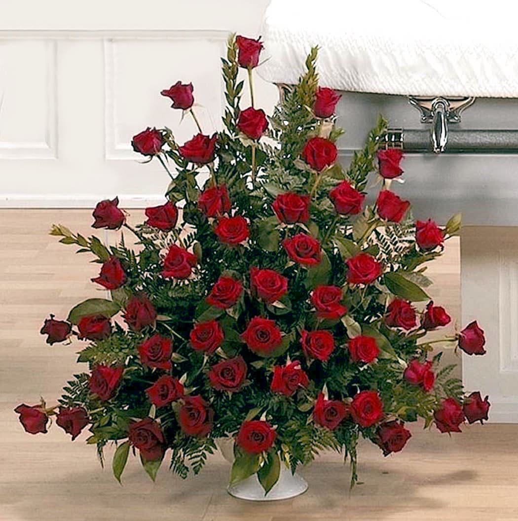 Large Red Rose Grandeur Tribute - Stunning presentation of red roses filling a large floral urn and representing love and admiration. Can be done in other colors. Creates a stunning rich display for home or service.