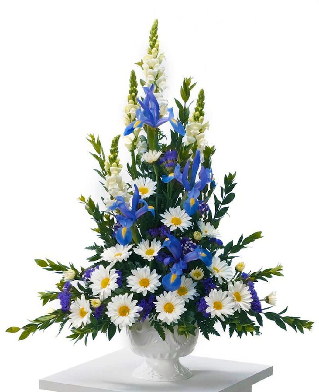 Heavens Rise  - Pedestal arrangement including snapdragons, daisies, iris and statice. Simply beautiful for any type of sympathy services.