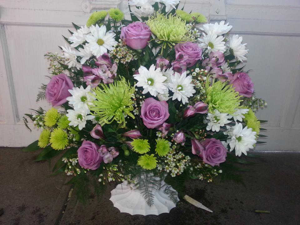 Green, White, & Lavender Sympathy Basket Green, White, & Lavender Sympathy Basket - An arrangement of Green Fuji Mums, Cushion Mums, Daisy, Roses, Alstroemeria and Waxflower