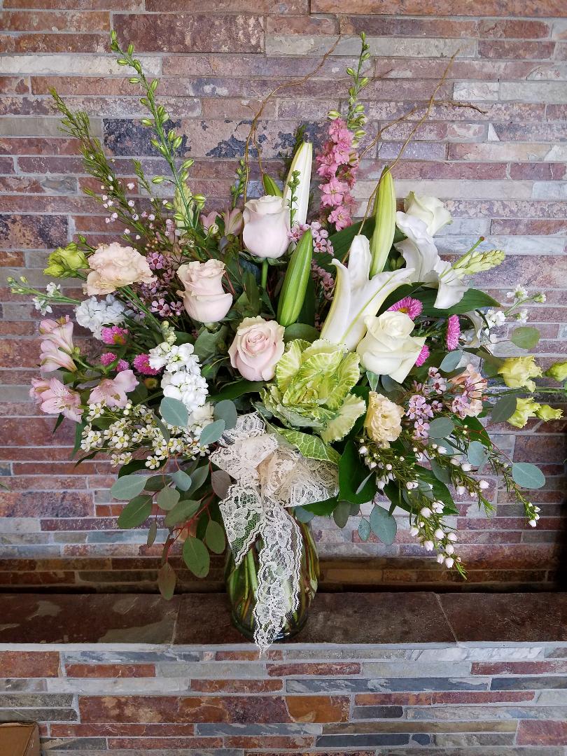 Spring Beauty Spring Beauty - Our large vase is filled to the max with soft springy blossoms in shades of pink, white, and soft greens. It's a fantastic choice for many reasons.