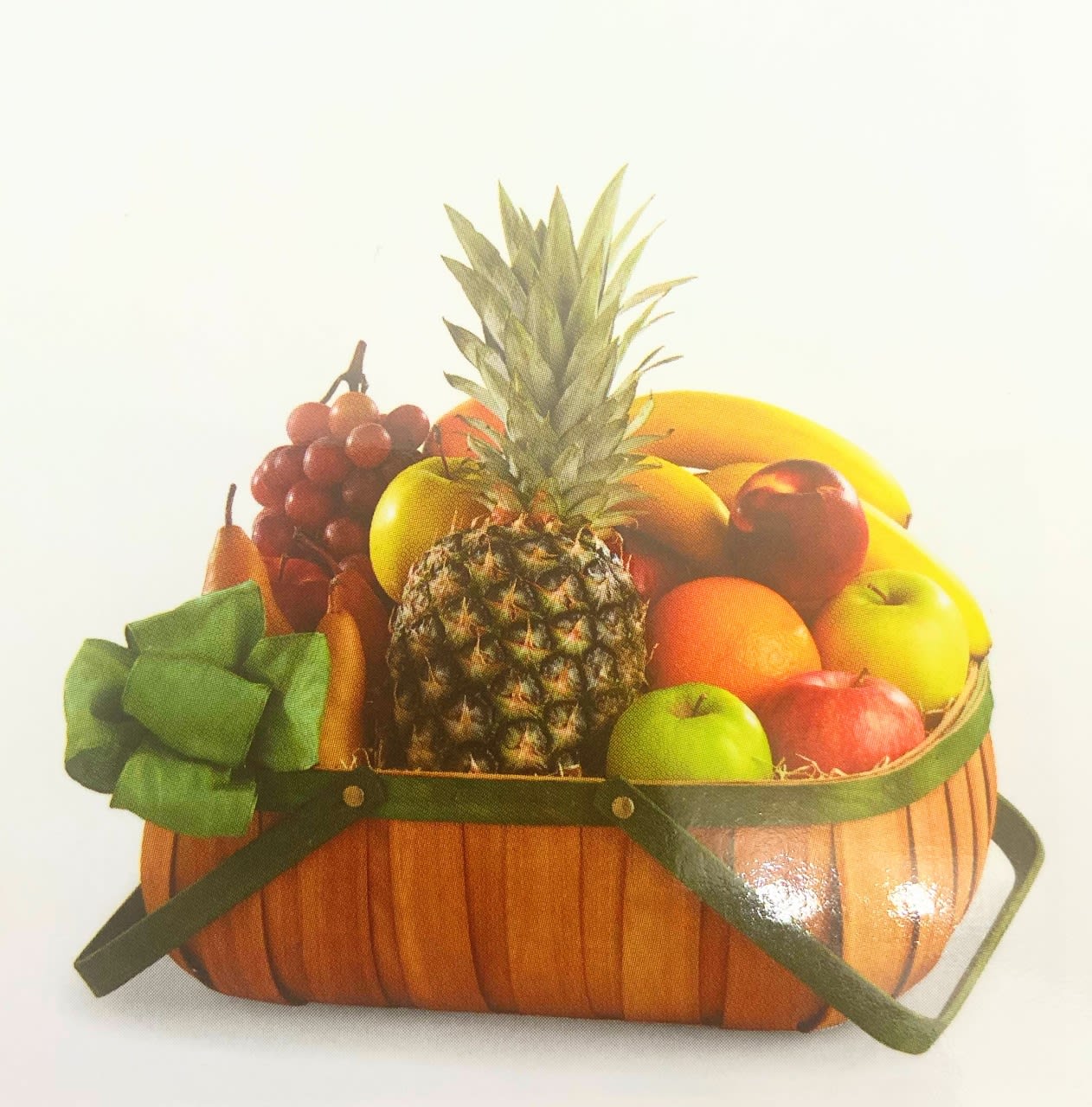 Bountiful Fresh Fruit Basket - Your gift of the freshest fruit available will be enjoyed by all who receive it. Attractively arranged in a sturdy wicker basket five different fruit including a pineapple will be enough to be enjoyed entire family and their guests.