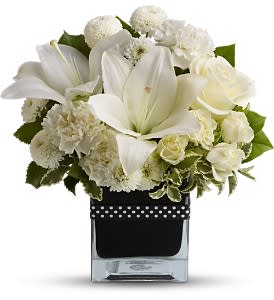 Teleflora's High Society - Time to put on the Ritz with elegant white lilies and roses in a stunning black glass cube vase decorated with a black and white polka dot cummerbund.