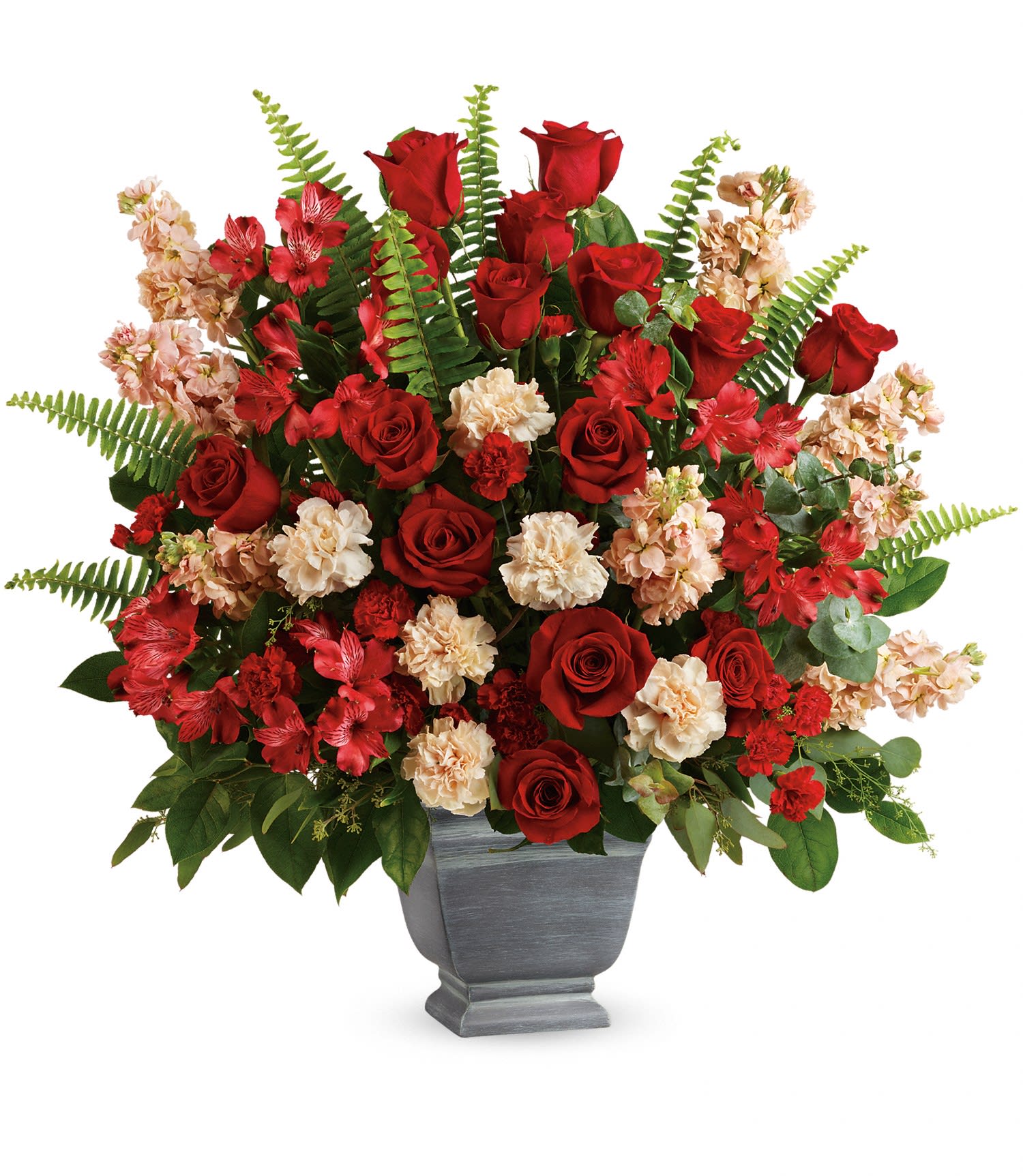 Bold Tribute Bouquet Deluxe - A bold expression of your deepest condolences, this elegant mix of red and peach blooms in a large container brings strength and comfort with blooms of Red Roses,Peach Stock,Peach Carnations,and Red Mini Carnations.