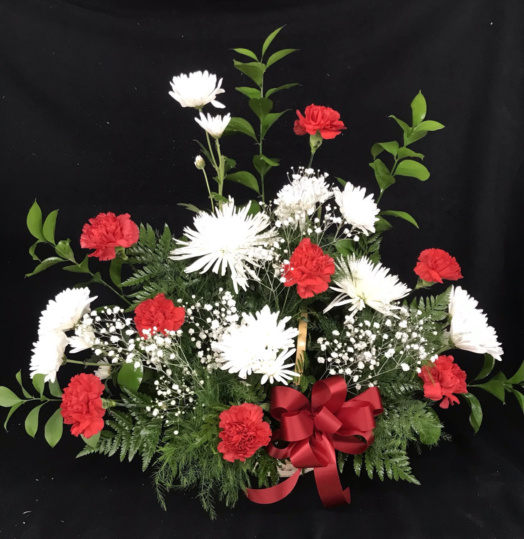Wicker arrangement  - This is one sided arrangement in red and white flowers 