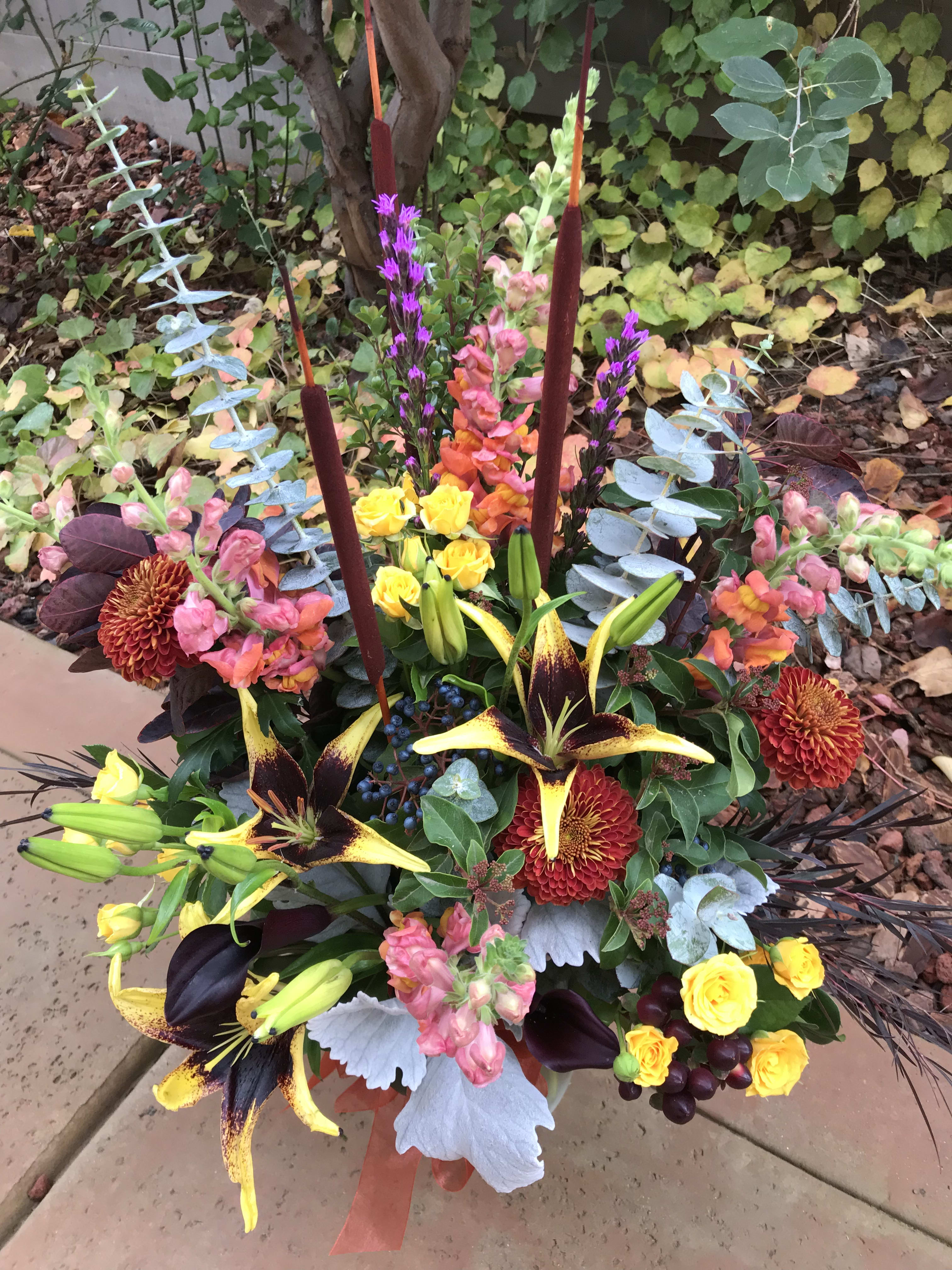 Vibrant Autumn Mix - Our most vibrant fall mix of fall flowers and accents. Assortment will vary but will be sure to spark interest and appeal. 