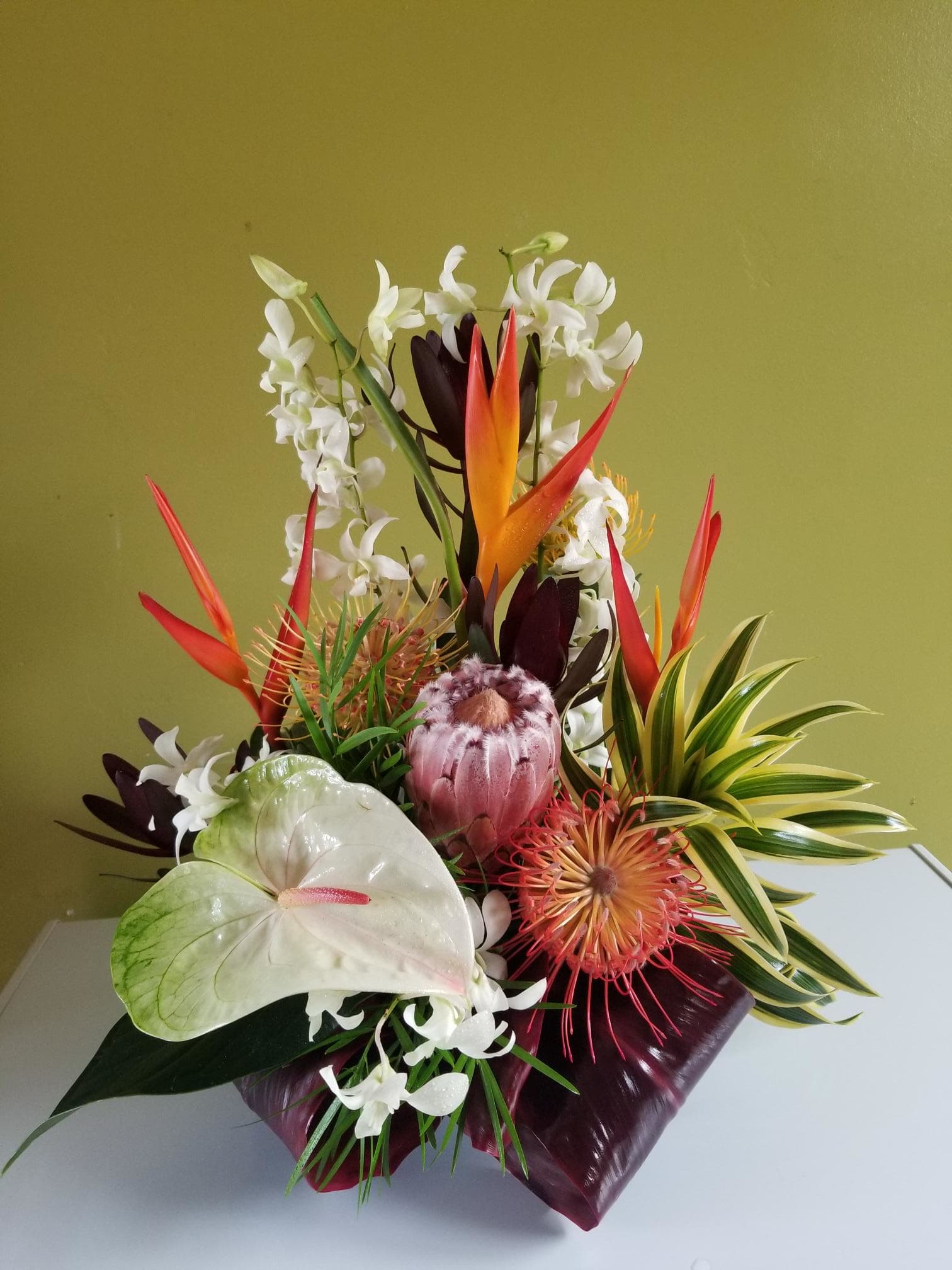 Tropical protea - Mid size tropical arrangement featuring fresh Big Island protea and other tropicals. Perfect for a gift or just because.